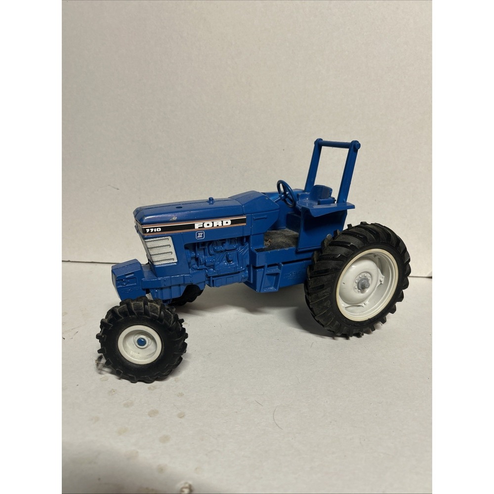 Vintage Ertl Blue Ford 7710 Toy Tractor - 1/16 Scale Die-Cast Farm Model